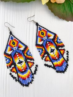 Southwestern Beaded Earrings With Tassels For Festival, Traditional Multicolor Jewelry With Beaded Fringe, Festival Multicolor Beaded Fringe Chandelier Earrings, Southwestern Tassel Earrings For Festivals, Traditional Colorful Round Bead Earrings, Traditional Blue Beaded Earrings With Colorful Beads, Traditional Beaded Dangle Earrings With Tassels, Traditional Beaded Fringe Tassel Earrings For Festivals, Traditional Beaded Tassel Dangle Earrings