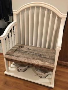 a wooden bench with two white vases sitting on it's back end in front of a closet