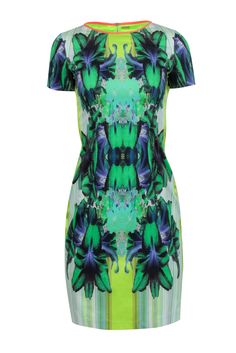 Stand out in the crowd with this funky and fun Elie Tahari dress. Featuring a vibrant green and multi-color print, this short-sleeved dress is perfect for any occasion. Pair it with a neutral pointed-toe pump to complete the look. Get ready to turn heads! Size 4 Shell 97% Cotton, 3% Elastane Neck trim 93% Silk, 7% Elastane Sides 95% Silk, 5% Spandex Lining 100% Polyester Exposed back zipper Short sleeves Blemishes side panels Bust 32" Waist 28" Shoulder to hem 37.5" Sleeve length 7" Printed Short Sleeve Party Dress, Short Sleeve Printed Party Dress, Casual Multicolor Tropical Print Dress, Spring Multicolor Abstract Print Mini Dress, Printed Green Knee-length Mini Dress, Multicolor Short Sleeve Mini Dress With Vibrant Print, Colorful Printed Vibrant Dresses, Colorful Pattern Short Sleeve Summer Dresses, Multicolor Graphic Print Short Sleeve Dress