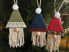 three ornaments hanging from a christmas tree