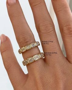 a woman's hand with three rings on it and the measurements for each ring