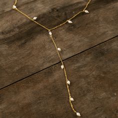 Delicate lariat gold necklace with interlaced pearls. Gold Necklace, Gold