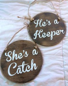 two wooden signs that say it's a keeper and she's a catch