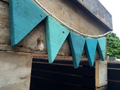 some blue flags are hanging from a building