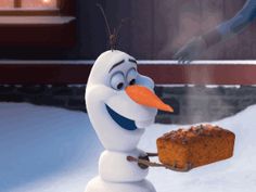 a snowman holding a piece of bread in his hand