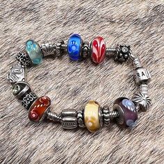 https://jewelrysalehub.com/ I don't know much about Pandora, but will do my best to describe this as well as I can. All are sterling and many with semi-precious stones as well. Includes 19 charms/beads including Great opportunity to get a pristine bracelet and charms. Multicolor Sterling Silver Beaded Bracelets, Luxury Multicolor Polished Beads Jewelry, Elegant Multicolor Sterling Silver Beaded Bracelets, Luxury Multicolor Sterling Silver Bracelets, Silver Beaded Bracelet Jewelry, Multicolor Polished Bead Bracelet, Silver Rondelle Jewelry With Large Beads, Multicolor Sterling Silver Bangle Bracelet, Luxury Adjustable Multicolor Jewelry