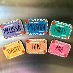 four magnets with different names on them