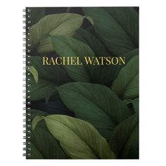 a spiral notebook with the words rachel watton on it and green leaves surrounding it