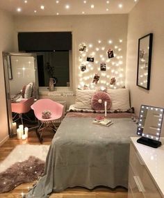 a bedroom with lights on the wall and a bed