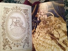 an open book with pictures of women dressed in fancy clothes and dresses on it's pages