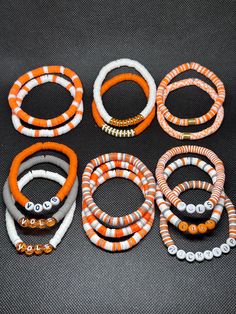 TN Vols game day accessories! Stack options can be any bracelet or bracelets you wish in the quantity you order.  colors may vary amongst different screens Bracelets Inspo Clay Beads, Cheap Sporty Stretch Bracelet For Game Day, Tennessee Vols Jewelry, Tennessee Clay Bead Bracelets, Easy Braclets Ideas, Tennessee Vols Bracelet, Fall Clay Beaded Bracelets, Clay Bead Bracelets Ideas Fall, Fall Themed Clay Bead Bracelets