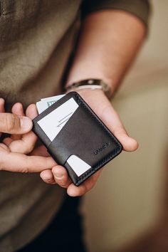 Men's Leather Cardholder, a stylish and functional accessory crafted from genuine leather. This slim and minimalist wallet is designed to fit perfectly in the front pocket, offering convenience and easy access while maintaining a sleek and sophisticated look. Made from high-quality leather, this wallet exudes a sense of luxury and durability. The premium leather not only ensures longevity but also develops a beautiful patina over time, adding character and uniqueness to each piece. The black lea Modern Card Holder With Interior Slots For Everyday Carry, Modern Card Holder For Everyday Carry With Interior Slots, Modern Leather Card Holder With Phone Sleeve, Modern Card Holder With Card Slots, Minimalist Leather Card Holder With Rfid Blocking, Modern Leather Card Holder For Everyday, Minimalist Leather Card Holder For Business, Minimalist Leather Card Holder For Everyday, Leather Card Holder With Hidden Phone Sleeve For Gift