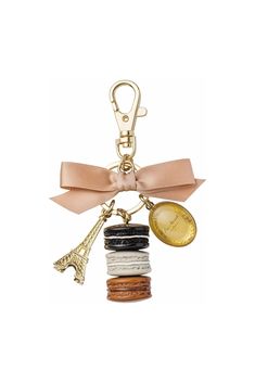 Ladurée Les Secrets - Réglisse - Bag Charm / Key Ring - NEW COLLECTION Lovely Macaron Bag Charm available in limited edition. Precious and sweet key chain / bag charm to carry around with you wherever you go. Paris Souvenirs, Gift Towers, Megan Hess, Perfect Handbag, Trendy Handbags, Handbag Charms, Beautiful Gift Boxes, Chain Bags, Key Holder