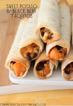 six black bean taquitass stacked on top of each other