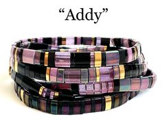 three bracelets with different colors and designs on them