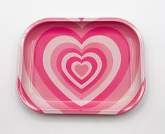 a pink and white heart shaped paper plate