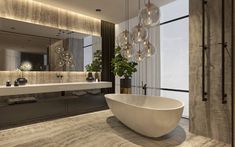 a large bath tub sitting next to a white sink in a bathroom under a mirror