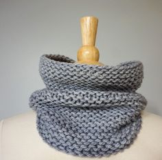 a gray knitted cowl on top of a mannequin