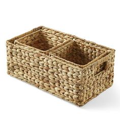 a woven basket with two compartments on the bottom and one in the middle, sitting against a white background