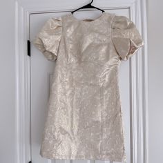 Never Been Worn And New With Tags. I Got Home And Realized I Bought The Wrong Size. It’s A Beautiful Pattern With A Cut Out And Bow In The Back. Puff Sleeve And Shiny Material. Vintage Mini Dress For Wedding, Lined Mini Dress For Wedding, Wedding Mini Dress Lined, Short Sleeve Mini Dress For Wedding, Wedding Mini Dress With Short Sleeves, Cream Short Sleeve Mini Dress For Party, Cream Short Sleeve Party Dress, Cream Puff Sleeve Mini Dress For Party, Cream Fitted Mini Dress For Casual Occasions