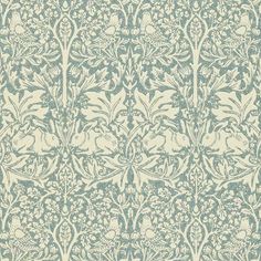 an intricately designed wallpaper with blue flowers and leaves on white background, in shades of green