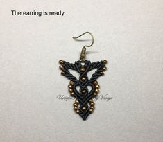 the earring is ready to be made with beading and metal beads on it