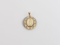 "Fabulous 14k Yellow Gold Virgin Mary Charm Pendant! Metal Purity: 14k Solid Gold , Stamped , Not plated Length: 3/4\" or 20 mm long Width: Almost 5/8\" or 15 mm wide Weight: 1.50 grams Complementary Gift Box There is a prayer around Mary which says: O Mary conceived without sin pray for us who have recourse to thee. This pendant is about the same size as a dime. Images may be enlarged to show detail and the item may look larger than it appears in person.In order to reduce buyer remorse and retu Commemorative White Gold Jewelry With Charms, Elegant Commemoration Jewelry With Charms, Anniversary Miraculous Medal Round Pendant Jewelry, Gold Jewelry With Miraculous Medal For Memorial, Gold Miraculous Medal Jewelry For Memorial, Yellow Gold Miraculous Medal Jewelry For Wedding, Wedding Yellow Gold Jewelry With Miraculous Medal, 14k Stamped Medallion For Anniversary, Anniversary Yellow Gold Jewelry With Miraculous Medal