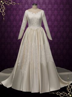 a white wedding dress on display in front of a purple background