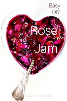 a heart shaped bowl filled with food and the words rose jam