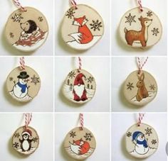 twelve handmade christmas ornaments with different designs and animals hanging from strings on the wall