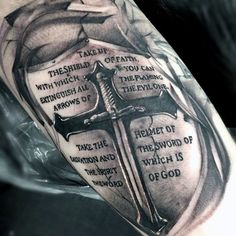 a cross and some words on the side of a man's arm with an arrow