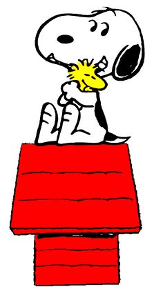 a cartoon snoopy sitting on top of a red table eating something out of his mouth