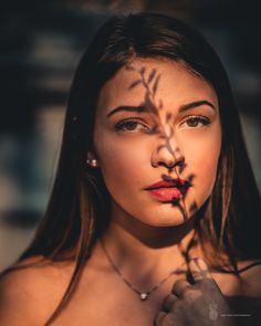 a woman with her shadow on her face