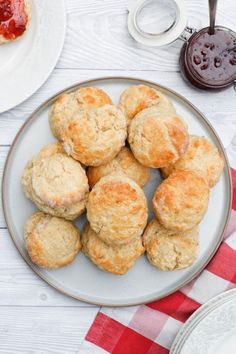 some biscuits are on a plate with jam