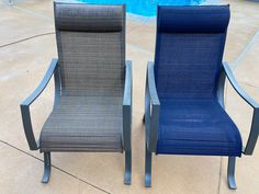 two chairs sitting next to each other in front of a swimming pool on cement ground