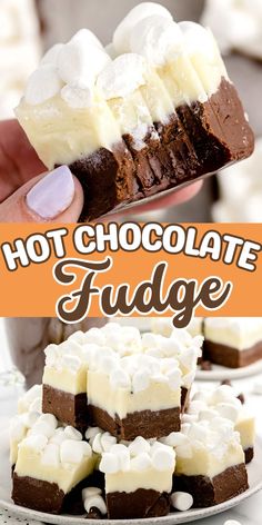 chocolate fudge with marshmallows and whipped cream in the middle is being held up