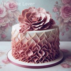 the cake is decorated with pink icing and has large flowers on each tiers