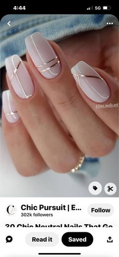 a woman's nails with white and pink designs on them, including gold accents