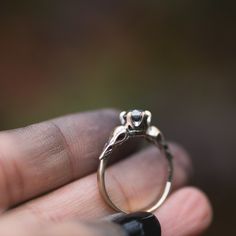 I hand carved a tiny bird skull in jewellers wax, and cast and molded it. I then used the mold to create a duplicate of the skull, and built this ring in wax. The wax model was cast using the lost wax casting method, where the wax is burned away, and the end result is solid 14k gold. The skulls are 4.5x11mm. This ring will be custom made for you, in your ring size. You can choose between yellow, rose or palladium white gold. The pictured ring is 14k yellow gold, with black rhodium that has been Heirloom Sterling Silver Hand Cast Jewelry, Heirloom Hand Cast Sterling Silver Jewelry, Carved Sterling Silver Skull Ring, Hand Cast 14k Gold Wedding Jewelry, Carved Sterling Silver Skull Ring For Gift, 14k Gold Wedding Jewelry Hand Cast, White Gold Skull Jewelry For Promise Ring, Bird Skulls, Witchy Ring