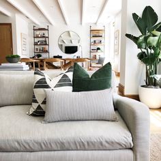 a living room filled with lots of furniture and decor