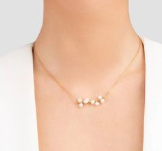 Exquisite craftsmanship meets timeless beauty in our 18K Solid Gold Handmade Dainty Pearl Cluster Necklace. Each necklace is artfully composed of a series of carefully selected pearls, clustered together to form a delicate and elegant centerpiece. Pearl: about 3mm in diameter chain length: about  42 centimeters Material:10k,14k,18k solid gold Style: Minimalism The pearls are arranged on a premium 14K solid gold horizontal bar, ensuring a luxurious look with a durable finish that promises longevi Pearl Necklace Handmade, Handmade Pearl Necklace, Pearl Cluster Necklace, Elegant Centerpiece, Dainty Pearl Necklace, Jewelry Promotion, Bridal Pearl Necklace, Seashell Jewelry, Necklace Elegant