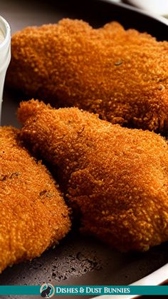 fried food on a plate with dipping sauce