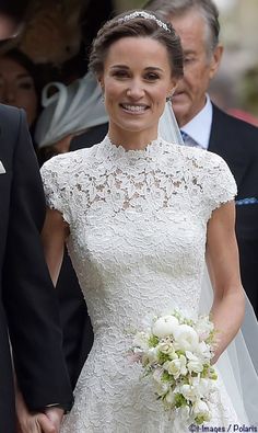 the bride and groom are all smiles as they walk down the aisle at their wedding