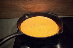 an iron skillet sitting on top of a stove