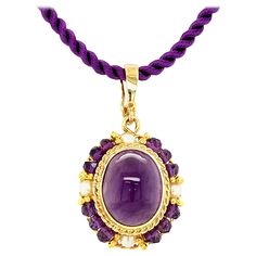 This elegant drop pendant features an oval amethyst cabochon with beautiful rich purple color, bezel set in a lovely handmade filigree setting. Amethyst beads and seed pearls are arranged in a halo frame around the center gem, accented with fine 18k yellow gold details. The Master Jeweler who created this pendant spent decades perfecting this timeless art with a level of skill rarely seen today. This is such a pretty piece, especially for anyone born in February or who just loves the color purpl Filigree Pendant Necklace, Citrine Pendant, Filigree Pendant, Rich Purple, Amethyst Color, Antique Necklace, Cabochon Pendant, Timeless Art, Amethyst Beads