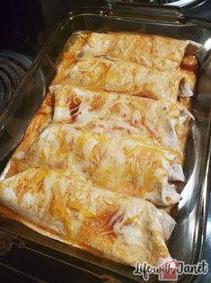 a pan filled with food sitting on top of a stove