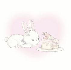 a drawing of a bunny next to a cake