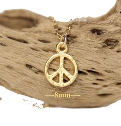 Dainty gold peace sign necklace, peace symbol jewelry, best friends gift, layering necklace, simple everyday necklace A dainty, gold vermeil peace sign hangs happily from 14k gold vermeil chain in the length of your choice! Perfect for layering :) This little peace charm measures 8mm. Looking for other charm necklaces? https://www.etsy.com/shop/BubuRuby?section_id=12318467 More from Bubu Ruby? https://www.etsy.com/shop/BubuRuby?ref=si_shop ♥ Handmade with love in sunny California ♥ These gems wi Gold Peace Sign Jewelry Gift, Gold Jewelry With Peace Sign For Gift, Jewelry Best Friends, Peace Sign Jewelry, Symbol Jewelry, Peace Sign Necklace, Sign Necklace, Sunny California, Symbolic Jewelry