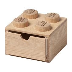 a wooden toy with four knobs in it