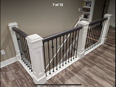 the stairs are painted white and have black railings